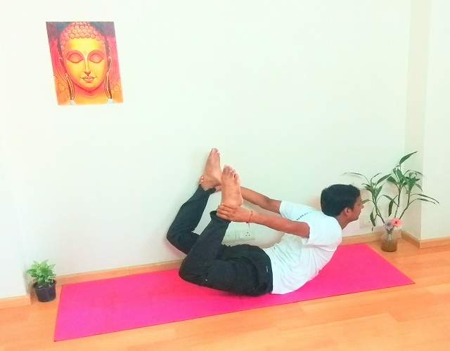 Dhanurasana pose Ayush Yoga Gurugram